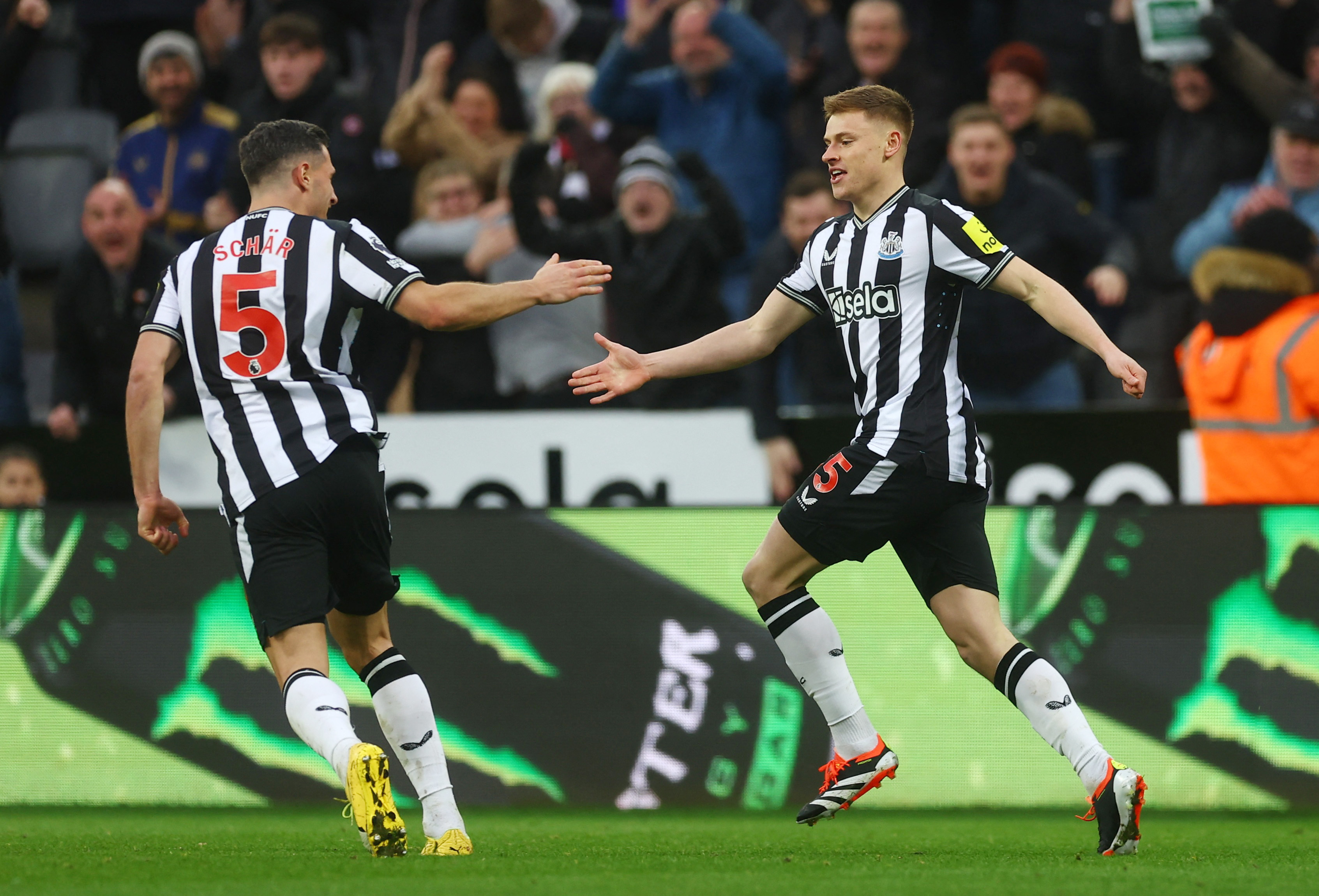 Newcastle United’s Harvey Barnes celebrates scoring their fourth goal with Fabian Schar. (Action Images via Reuters)