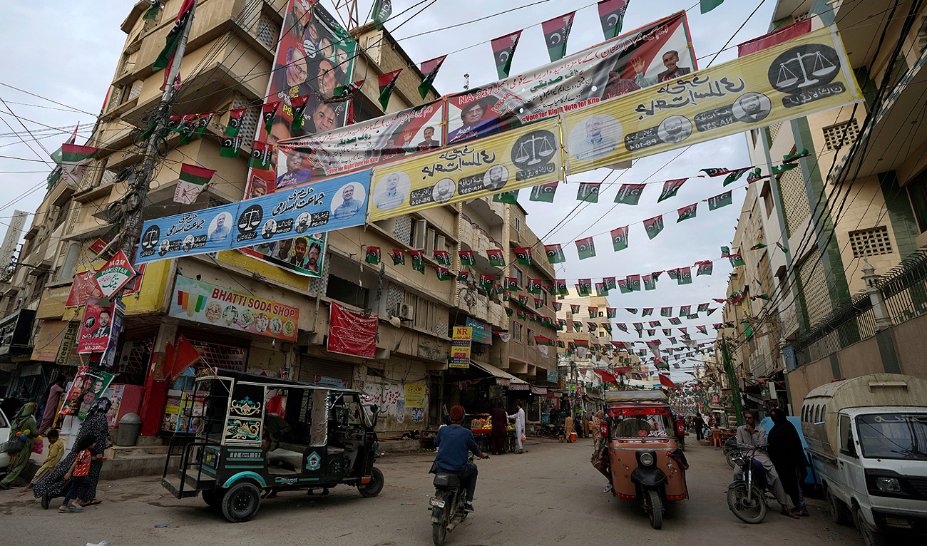 Party flags and banners of election candidates from political parties are displayed on a street ahead of Feb. 8 general elections in Karachi on February 2, 2024. (AP)