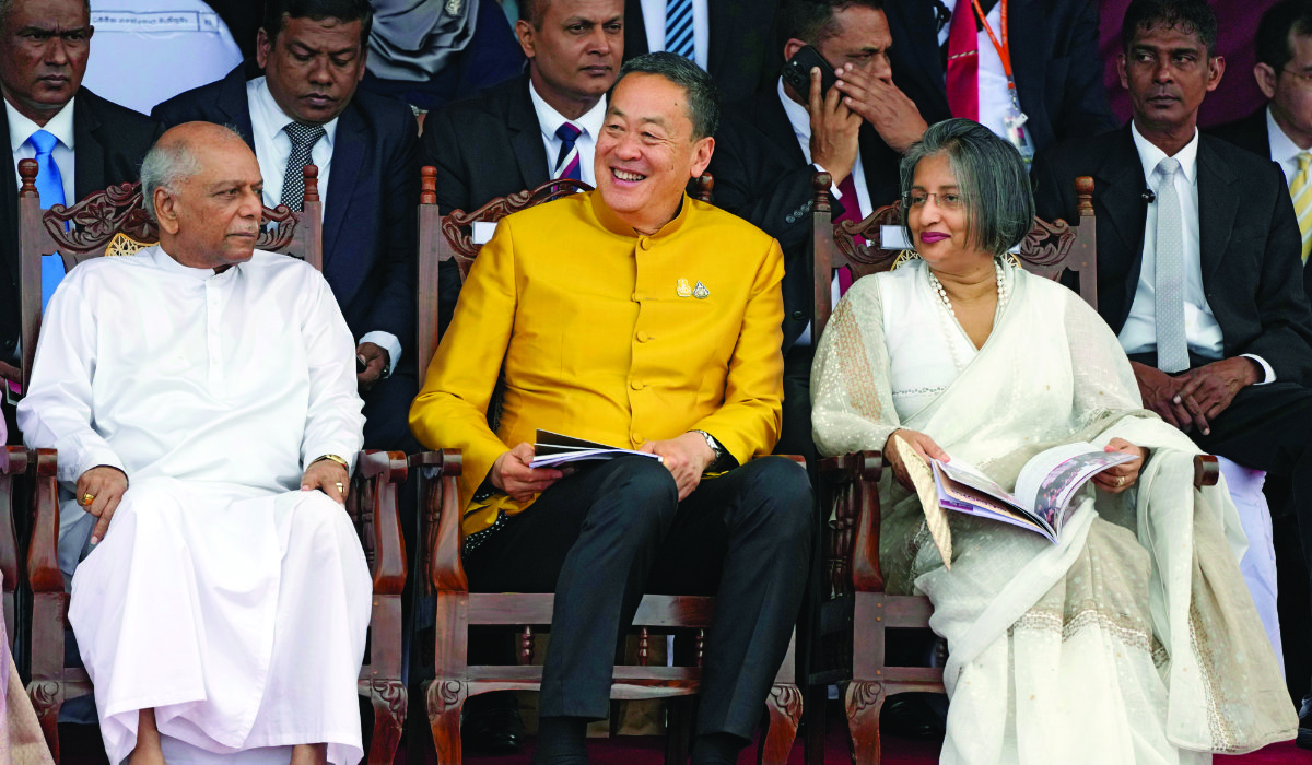 Thai Prime Minister Srettha Thavisin, center, sits with Sri Lankan Prime Minsiter Dinesh Gunawaradane, left, and the first lady of Sri Lanka, Maithree Wickremesinghe, during the 76th Independence Day commemoration ceremony of Sri Lanka in Colombo, Sri Lanka, on Sunday. (AP)