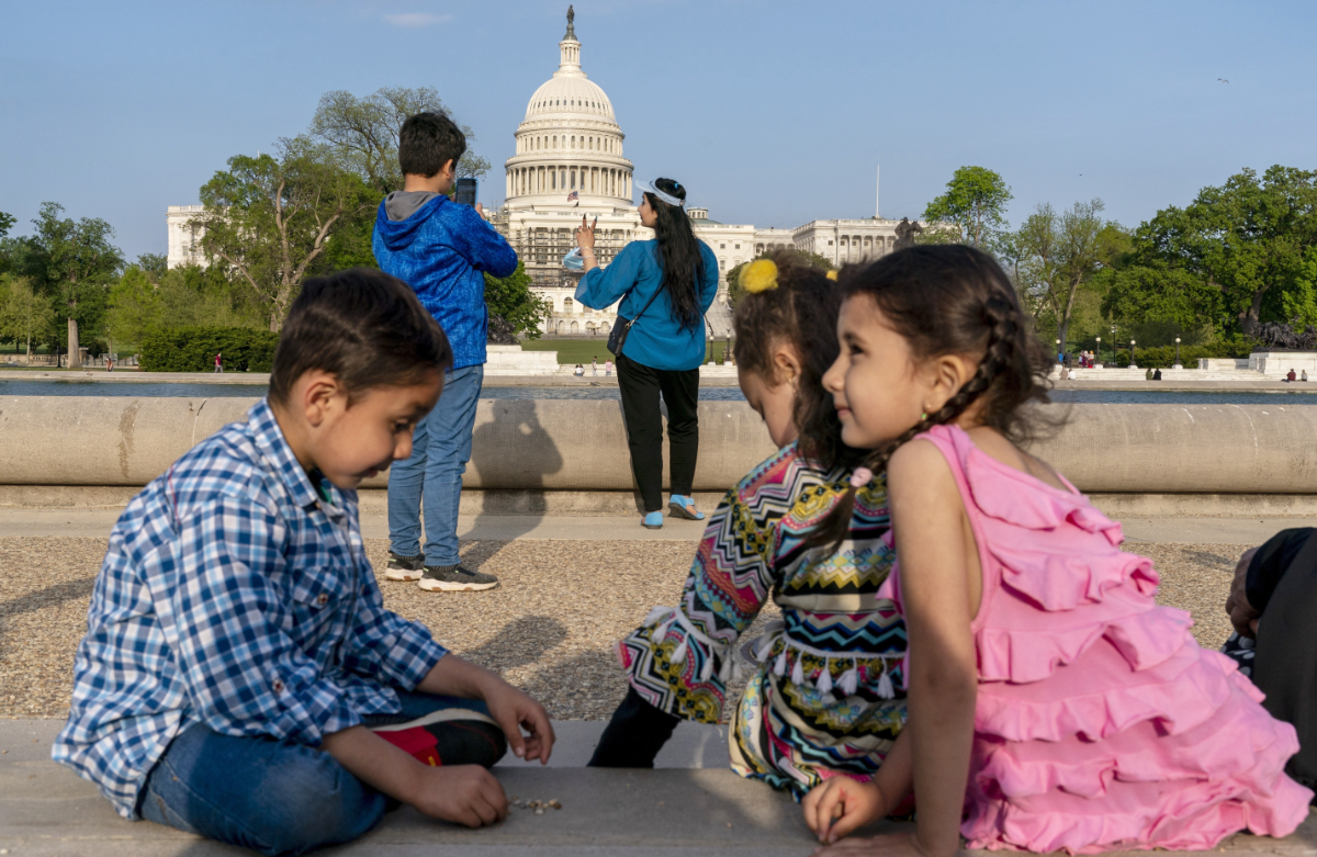 Members of the Safi family, who were evacuated from Afghanistan and are trying to make a new life in the U.S. while in immigration limbo, celebrate Eid by taking family photographs on the National Mall, May 3, 2022, near the U.S. Capitol in Washington. (AP)
