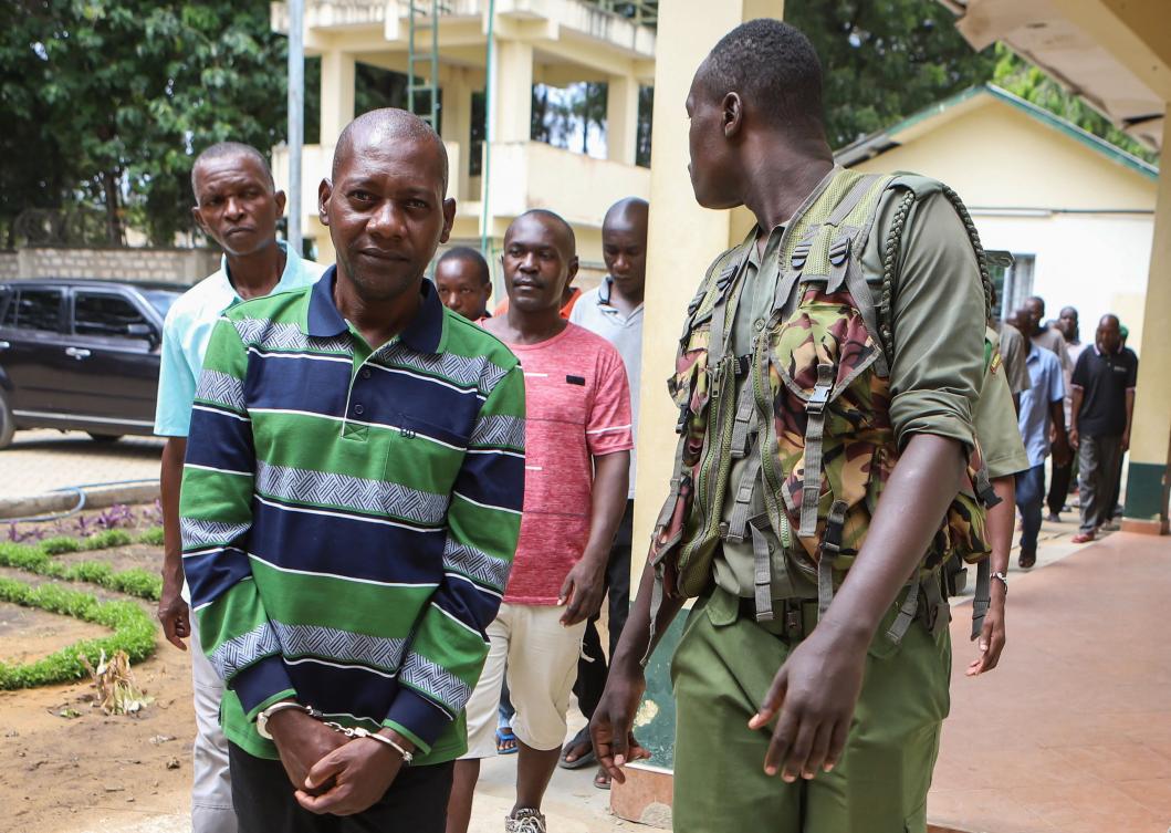 Questions have been raised about how self-proclaimed pastor Paul Nthenge Mackenzie, left,managed to evade law enforcement despite a history of extremism and previous legal cases. (AFP)