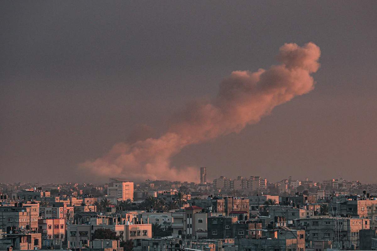 Smoke rises over buildings in Khan Yunis following Israeli bombardment on February 5, 2024. (AFP)