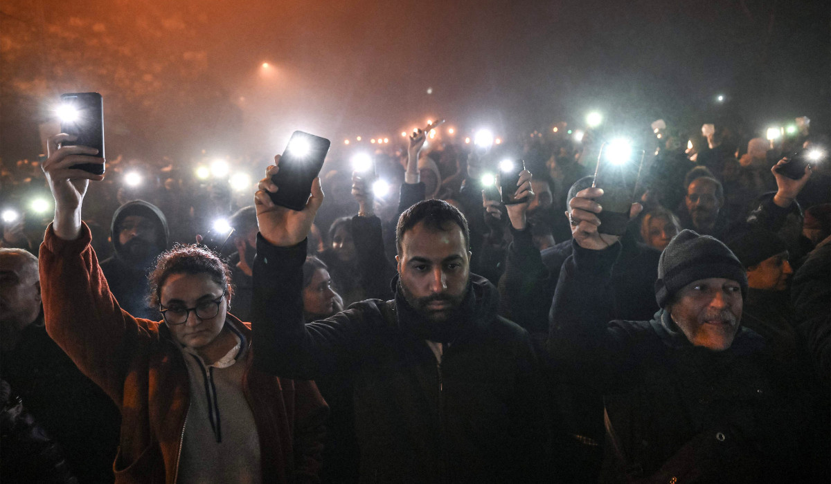 People take part in a vigil to mark the first anniversary of the earthquake, in Antakya on Tuesday. (AFP)