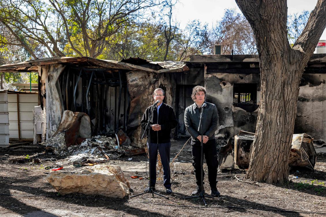 Argentina’s President Javier Milei and Israel’s President Isaac Herzog give remarks to the media during a tour around Kibbutz Nir Oz on Feb. 8, 2024. (AFP)