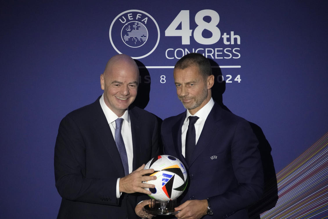 UEFA President Aleksander Ceferin and FIFA President Gianni Infantino pose during the 48th UEFA congress in Paris, on Feb. 8, 2024. (AP)
