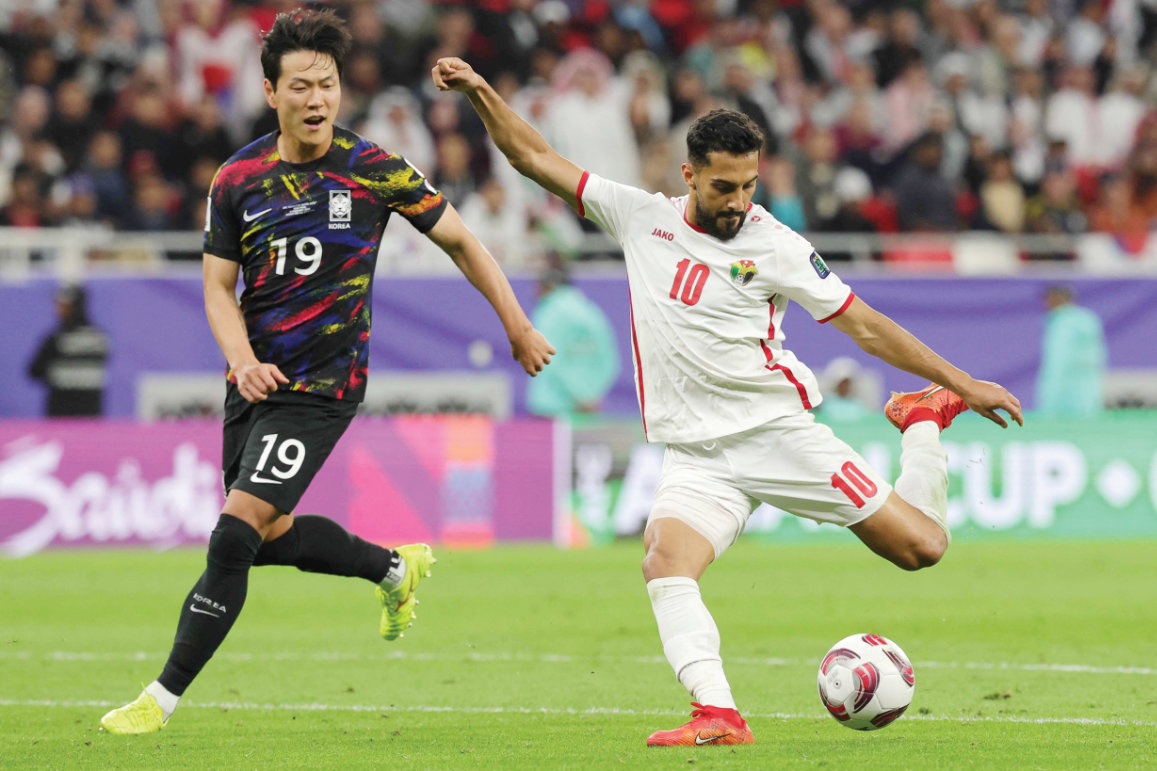 Jordan’s Musa Al-Tamari kicks the ball past South Korea’s Kim Young-gwon at the Qatar 2023 AFC Asian Cup. (AFP)