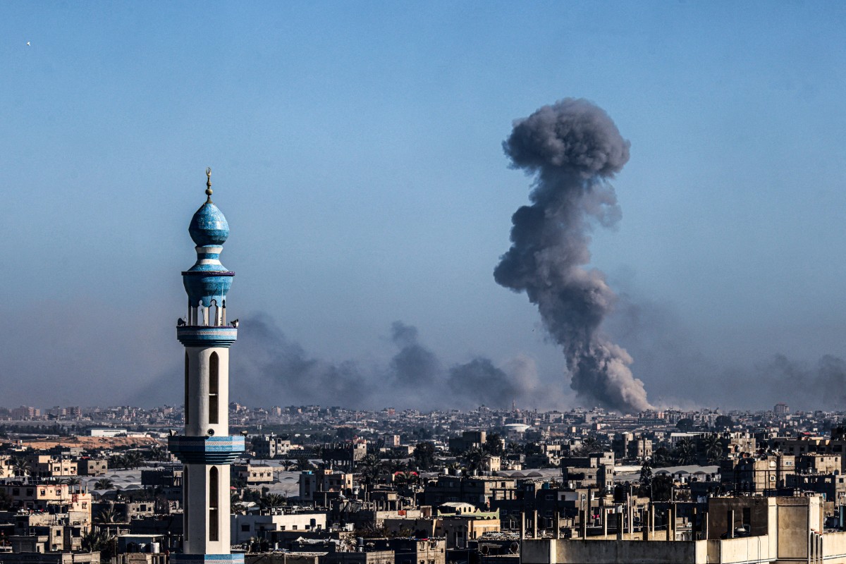 A picture taken from Rafah shows smoke billowing during Israeli bombardment over Khan Yunis in the southern Gaza Strip on February 11, 2024. (File/AFP)