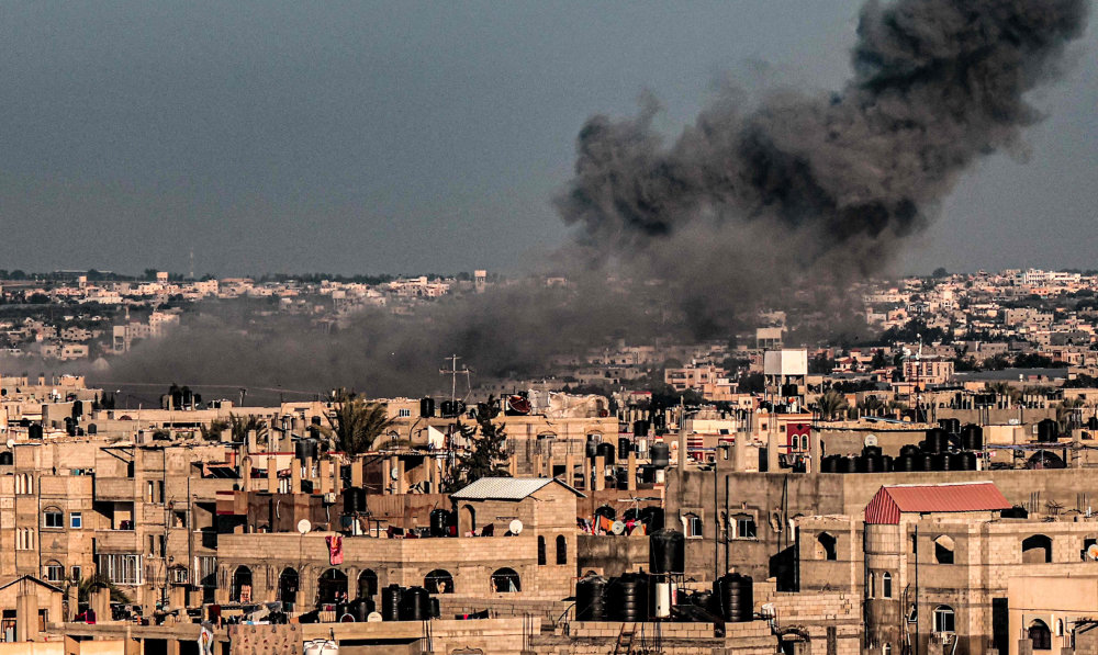 A smoke plume erupts during Israeli bombardment over Rafah in the southern Gaza Strip on February 11, 2024, amid the ongoing conflict between Israel and the Palestinian militant group Hamas. (AFP)