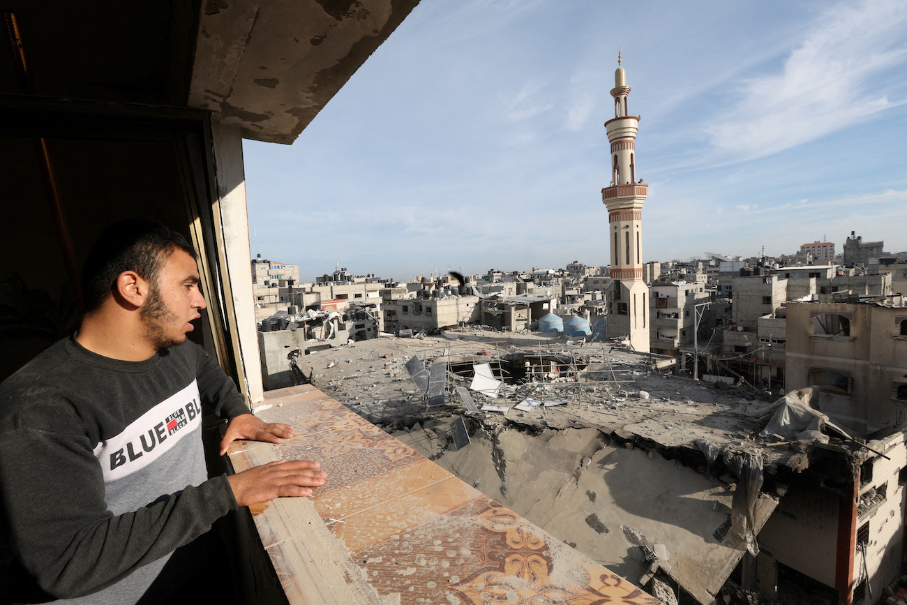 A Palestinian man looks at the site of an Israeli strike on a mosque in Rafah in the southern Gaza Strip, February 12, 2024. (Reuters)
