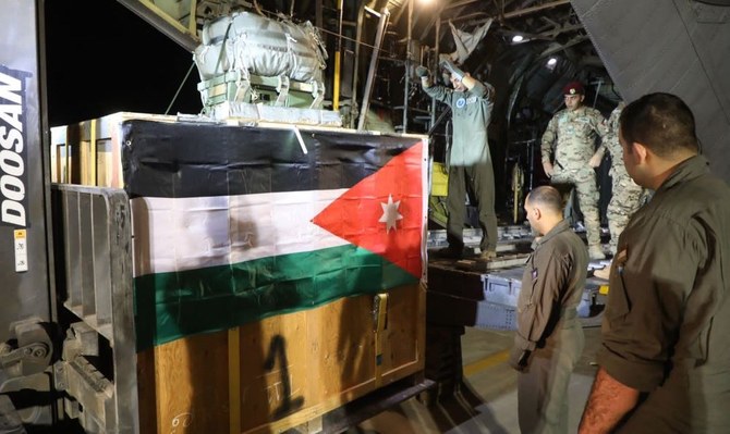 Humanitarian aid, bound for Gaza, is loaded into a Jordanian air force plane. (AFP)