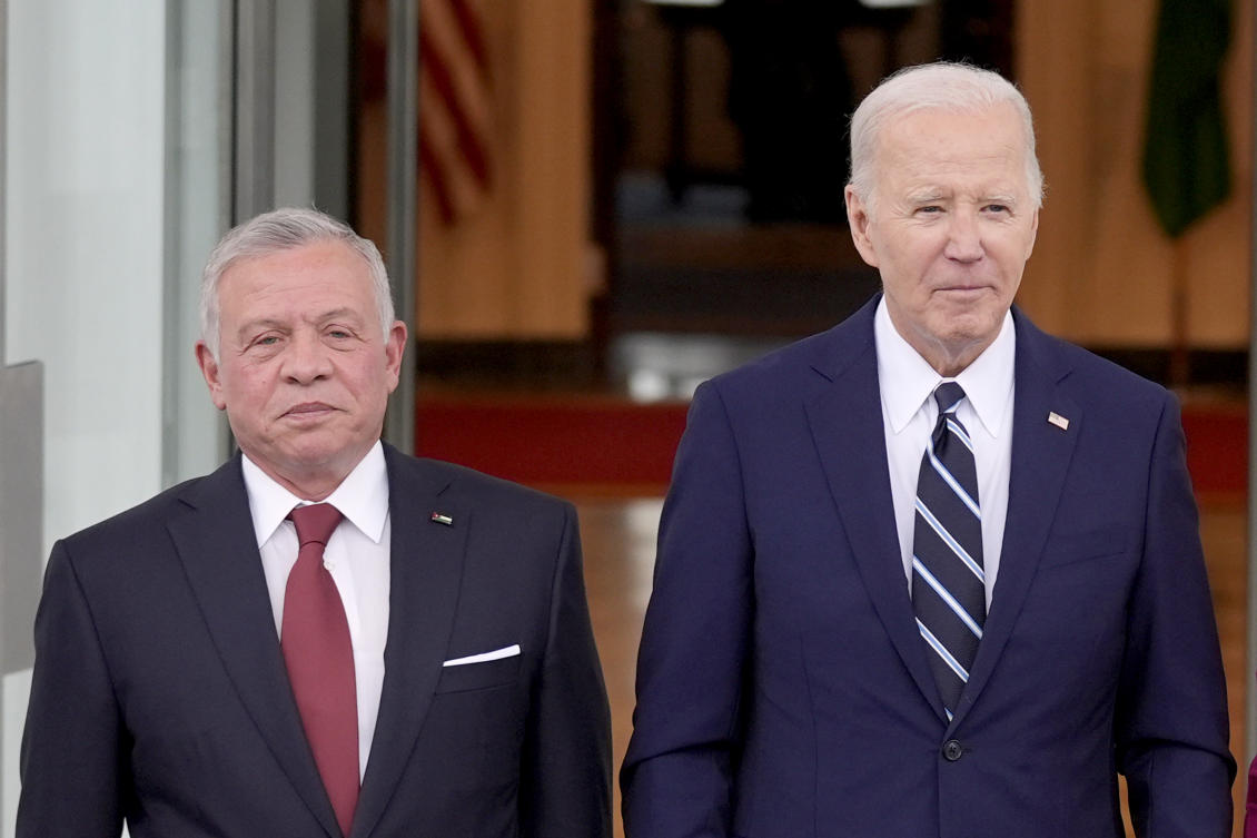 President Joe Biden, right, poses with Jordan's King Abdullah II on the North Portico of the White House, Monday, Feb. 12, 2024, in Washington. (AP)