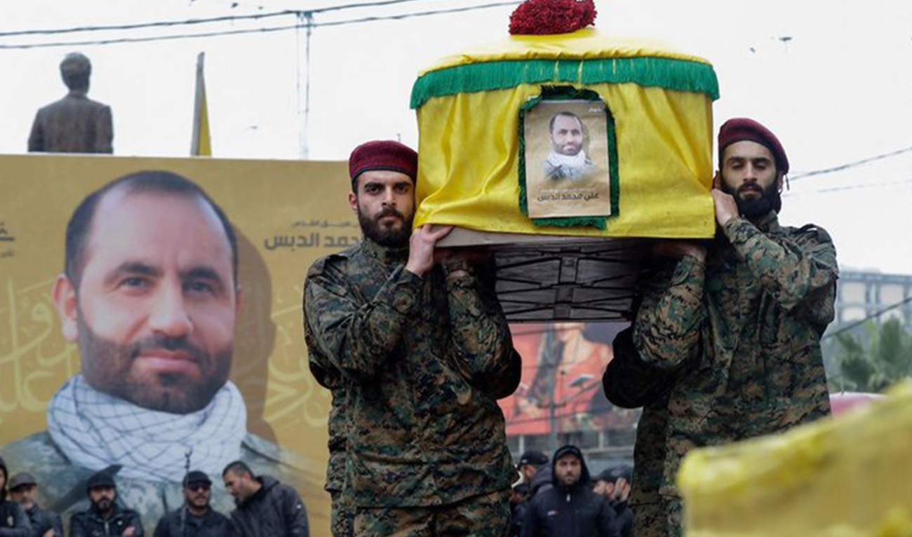 Hezbollah militants and supporters attend the funeral of Ali al-Debs, one of the militant group's commanders killed by an Israeli air raid two days earlier, in Lebanon's southern city of Nabatieyh on February 16, 2024. (AFP)