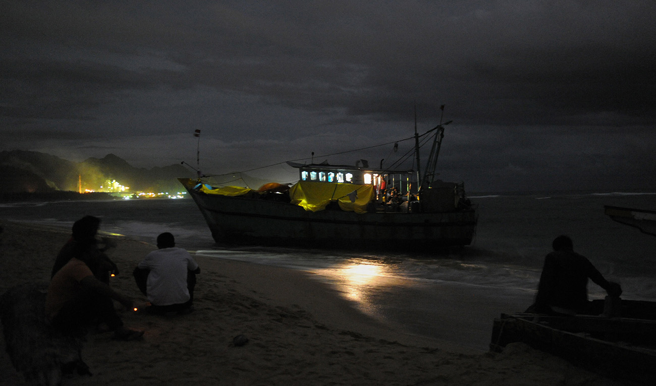 This picture taken on June 14, 2016 shows a night shot of a boat of migrants reportedly headed from Sri Lanka to Australia. (AFP/File)