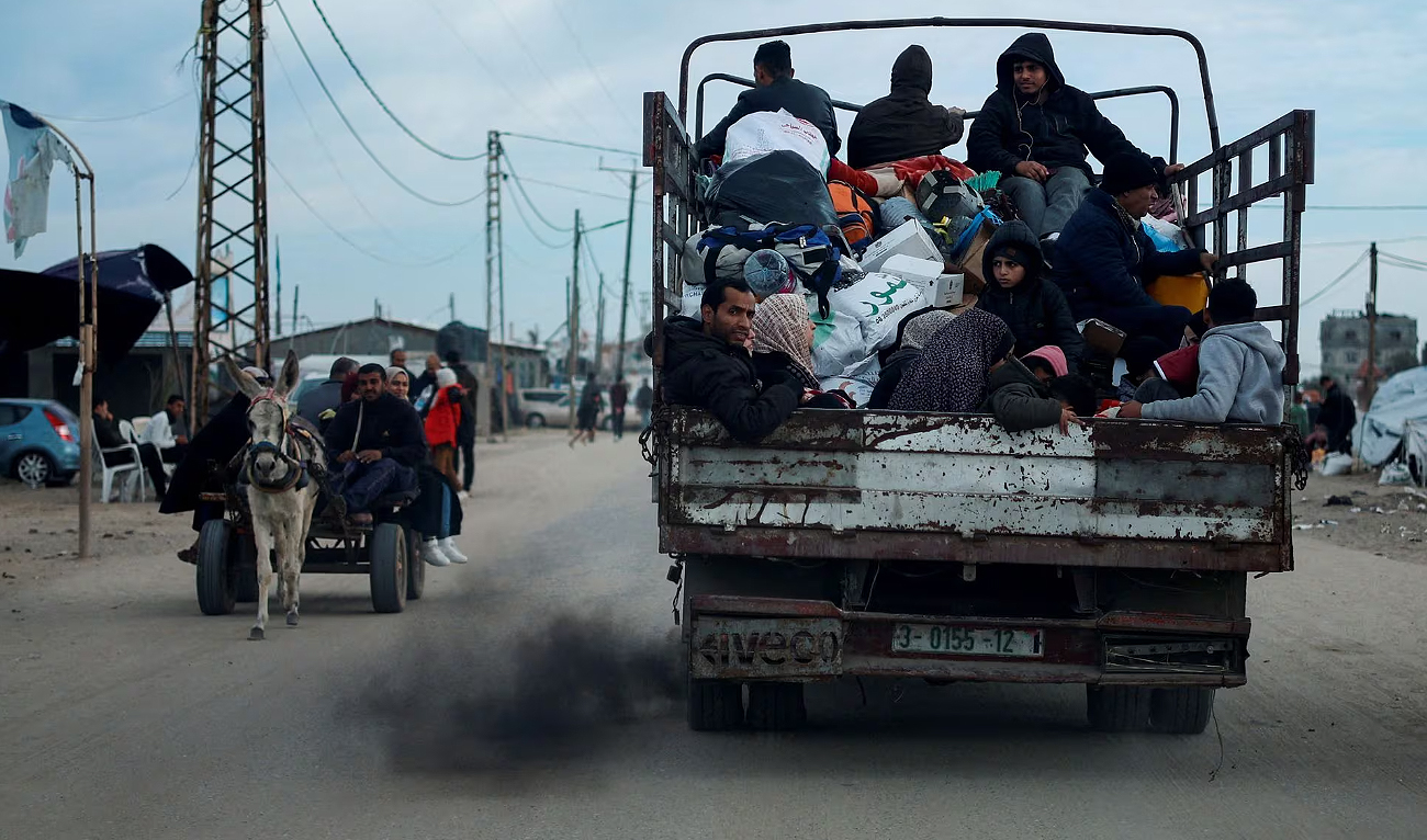Palestinians leave Rafah, in fear of an Israeli military operation, amid the ongoing conflict between Israel and Palestinian group Hamas in the southern Gaza Strip, February 13, 2024. (REUTERS)