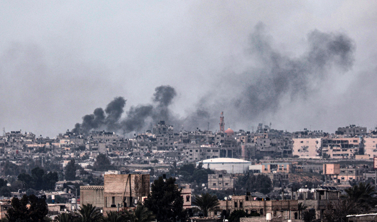 A picture taken from Rafah shows smoke billowing over Khan Yunis in the southern Gaza Strip during Israeli bombardment on February 18, 2024. (AFP)