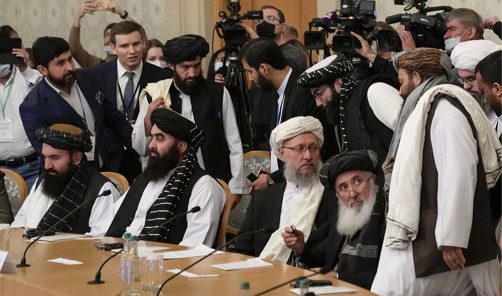 Taliban official Abdul Salam Hanafi, center, and other members of the political delegation from the Afghan Taliban's movement arrive to attend the talks involving Afghan representatives in Moscow, Russia, on October 20, 2021. (AP)