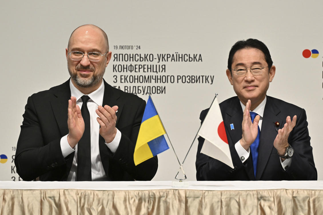 Ukraine's Prime Minister Denys Shmyhal and Japanese Prime Minister Fumio Kishida attend a memorandum of a cooperation exchange ceremony during the Japan-Ukraine Conference for Promotion of Economic Growth and Reconstruction in Tokyo. (AP)