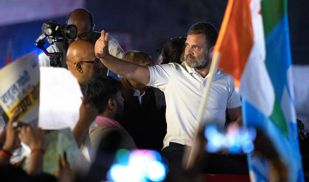 India's opposition Congress party leader Rahul Gandhi waves during his month-long cross-country march, in Lucknow, capital of northern Indian state of Uttar Pradesh, Tuesday, Feb. 20, 2024. (AP)