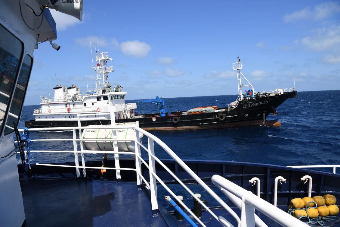 Above, a Chinese vessel maneuvers close to a Philippine Bureau of Fisheries and Aquatic Resources ship near the China-controlled Scarborough Shoal, in disputed waters of the South China Sea in this photo taken Feb. 16, 2024. (AFP)