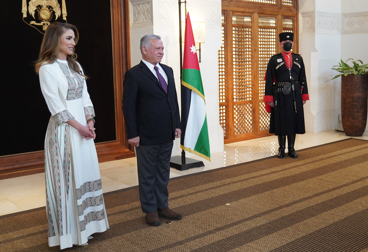 Jordan's King Abdullah II (R) and his wife Queen Rania (L) during a women's day function ahead of International Women's Day. (File/AFP)