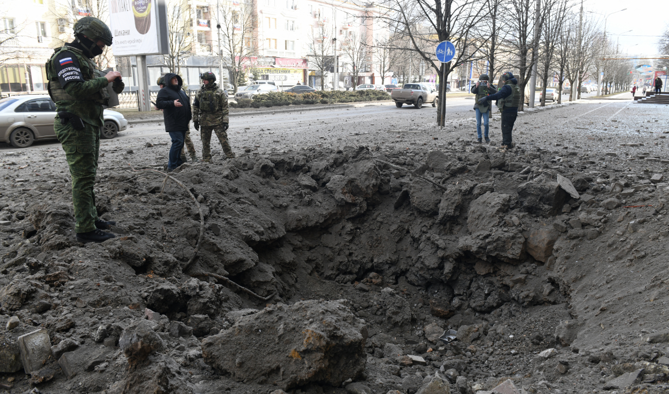 A military investigator inspects damage at the scene of recent shelling in Donetsk, Russian-controlled Ukraine, on February 20, 2024, amid the Russia-Ukraine conflict. (AFP/File)