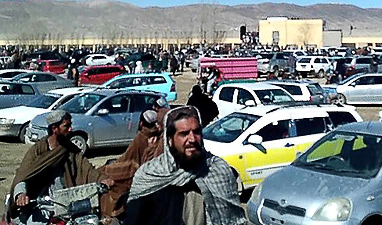 This screen grab from a video taken on January 22, 2024, shows Afghan men leaving a football stadium after attending the public execution by Taliban authorities of two men convicted of murder, in Ghazni. (AFP)