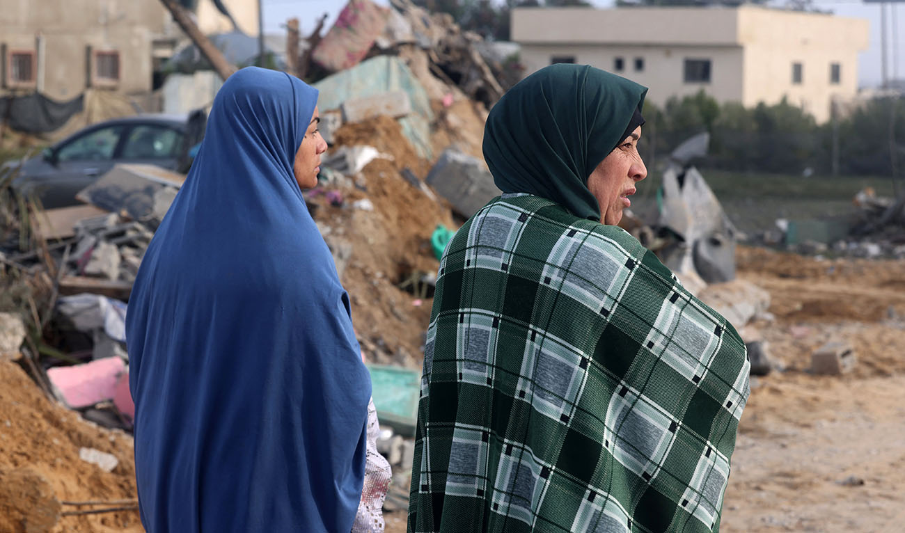 Women stand amid the destruction following overnight Israeli bombardment in Rafah in the southern Gaza Strip on February 23, 2024. (AFP)