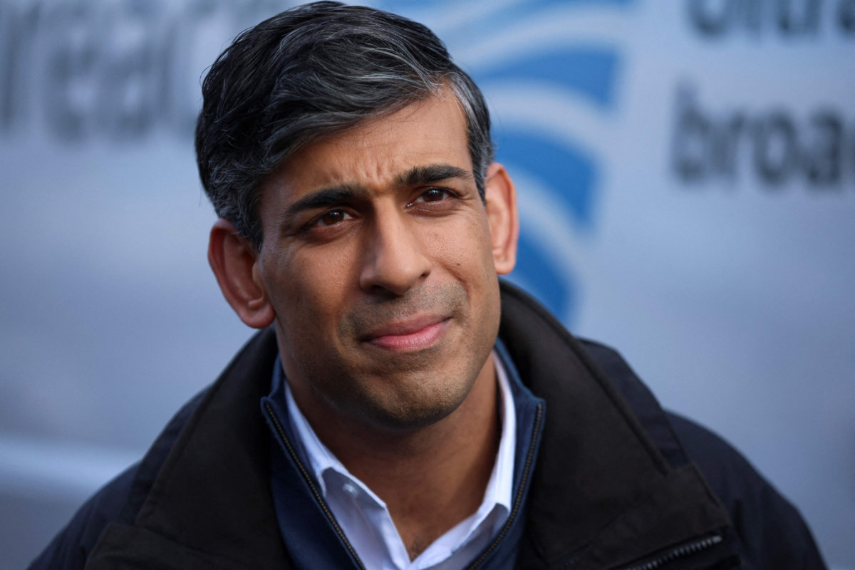 Britain's Prime Minister Rishi Sunak gives an interview, during a visit to an Openreach exchange in Anglesey, Wales, on Feb. 22, 2024. (Pool / AFP)