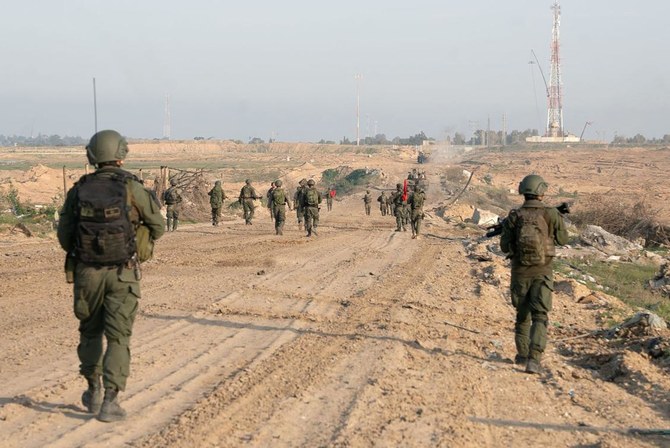 This handout picture released by the Israeli army on February 23, 2024 shows Israeli army soldiers on patrol at an unspecified location in the Gaza Strip amid ongoing battles between Israel and the Palestinian militant group Hamas. (AFP)