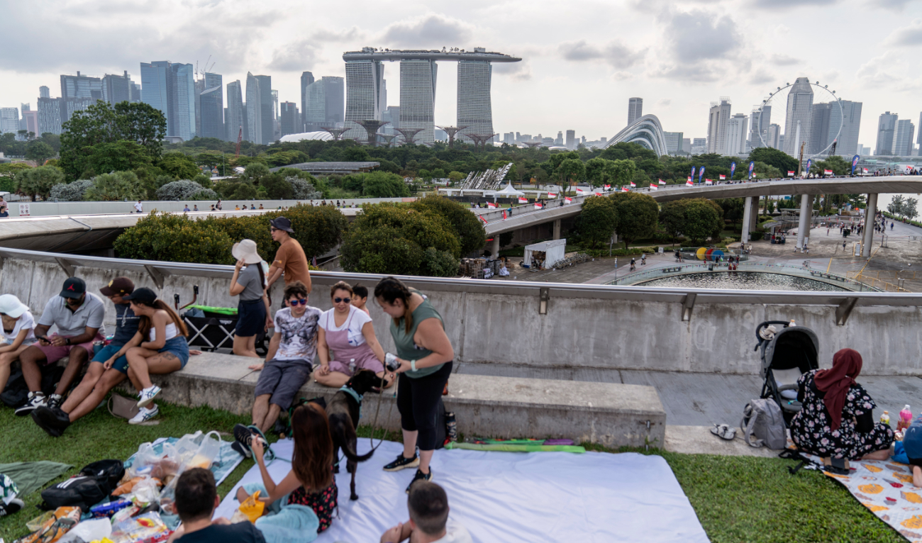 People picnic on the roof of the Marina Barrage pumping station. The barrage and the adjacent dam separates seawater to create a freshwater reservoir. (File/AFP)