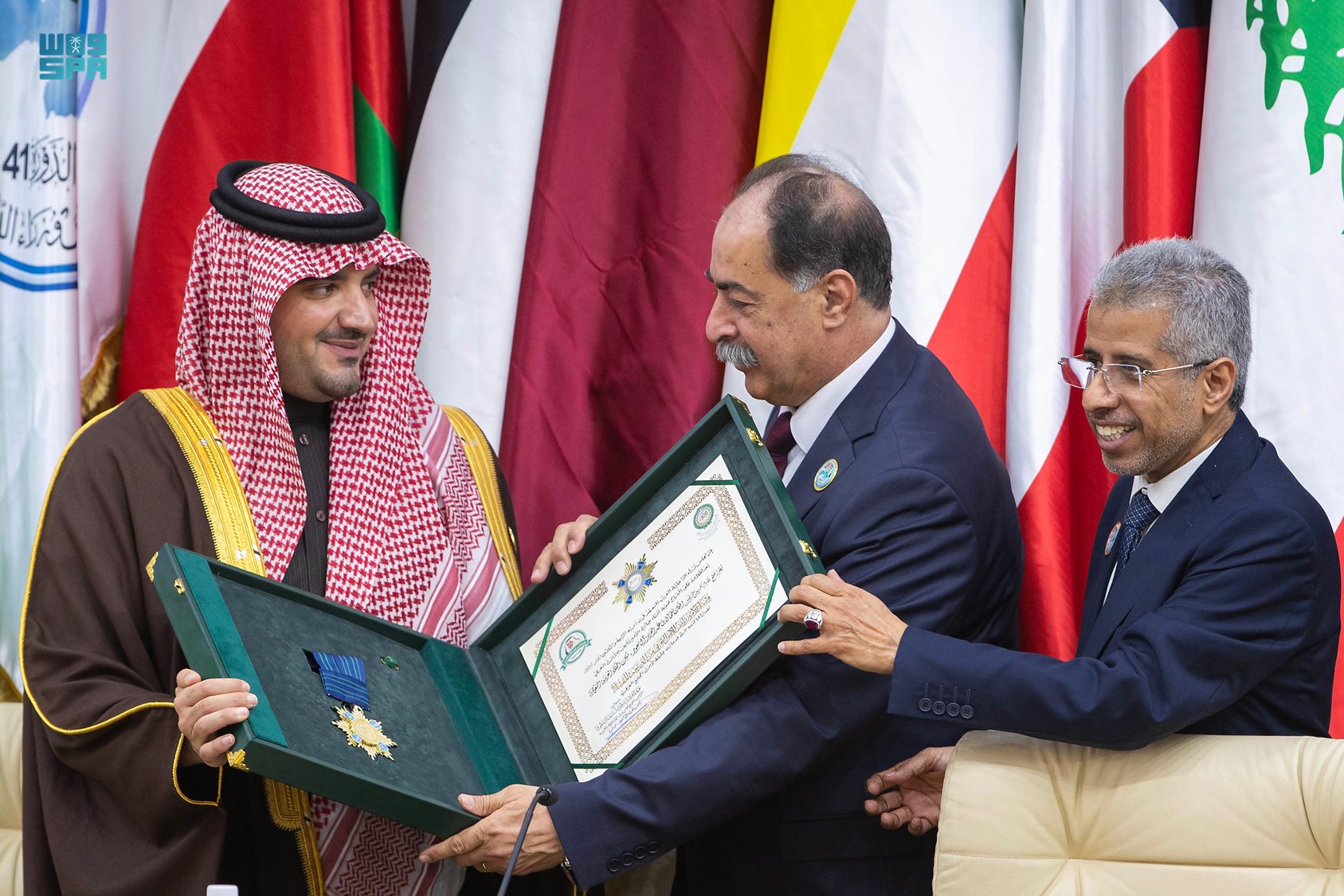 Saudi Interior Minister Prince Abdulaziz bin Saud receives the award on behalf of King Salman in Tunis. (SPA)