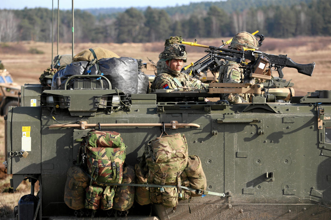 Above, soldiers sit in a military vehicle during the NATO’s Steadfast Defender Brilliant Jump 2024 military exercise in Drawsko Pomorskie, Poland on Feb. 26, 2024. (Agencja Wyborcza.pl via Reuters)