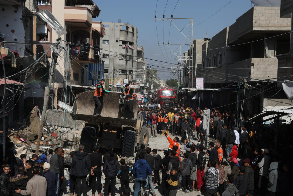 Palestinians gather at the site of an Israeli strike on a house in Rafah, in the southern Gaza Strip on Feb. 24, 2024. (Reuters)
