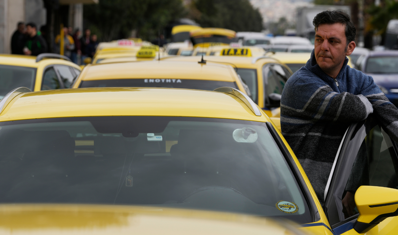 Taxi drivers gather during their rally in Athens, Greece, Tuesday. (AP)