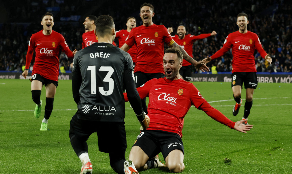 Mallorca's Dominik Greif and Sergi Darder celebrate after winning the penalty shoot-out on Tuesday during the Copa del Rey semifinal second leg between Real Sociedad and Mallorca at Reale Arena, San Sebastian, Spain. (Reuters)