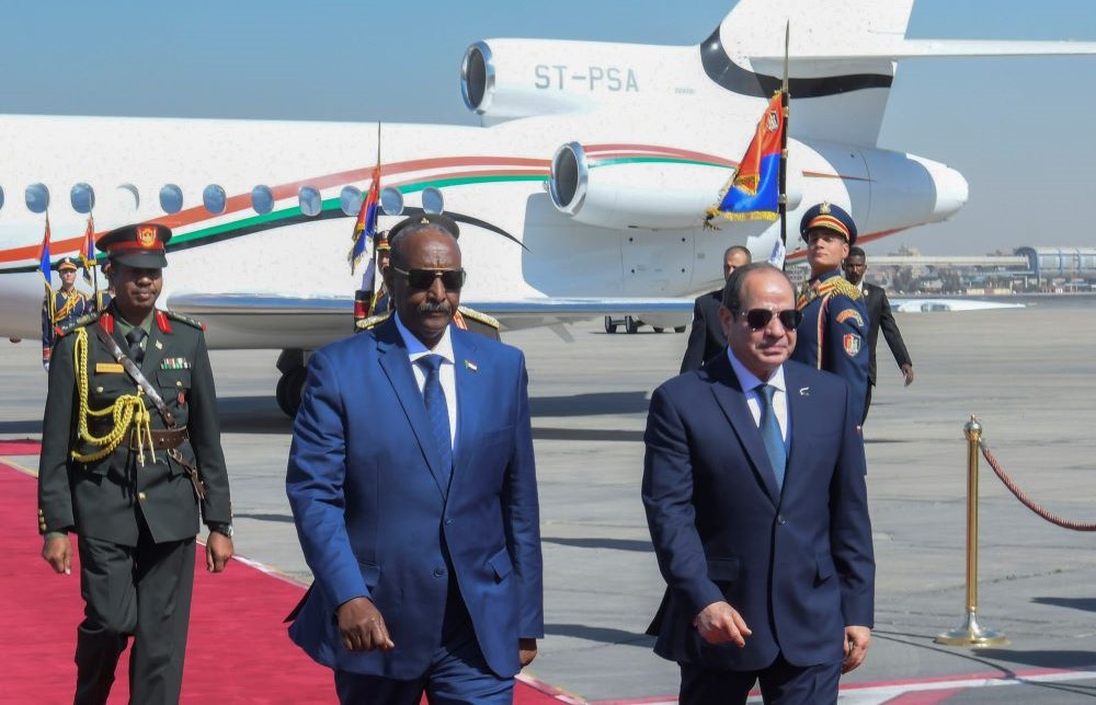 Abdel Fattah El-Sisi, right, meets Gen. Abdel Fattah Al-Burhan, Chairman of the Transitional Sovereignty Council of Sudan, upon his arrival at Cairo airport, Egypt, Feb. 29, 2024. (AP Photo)