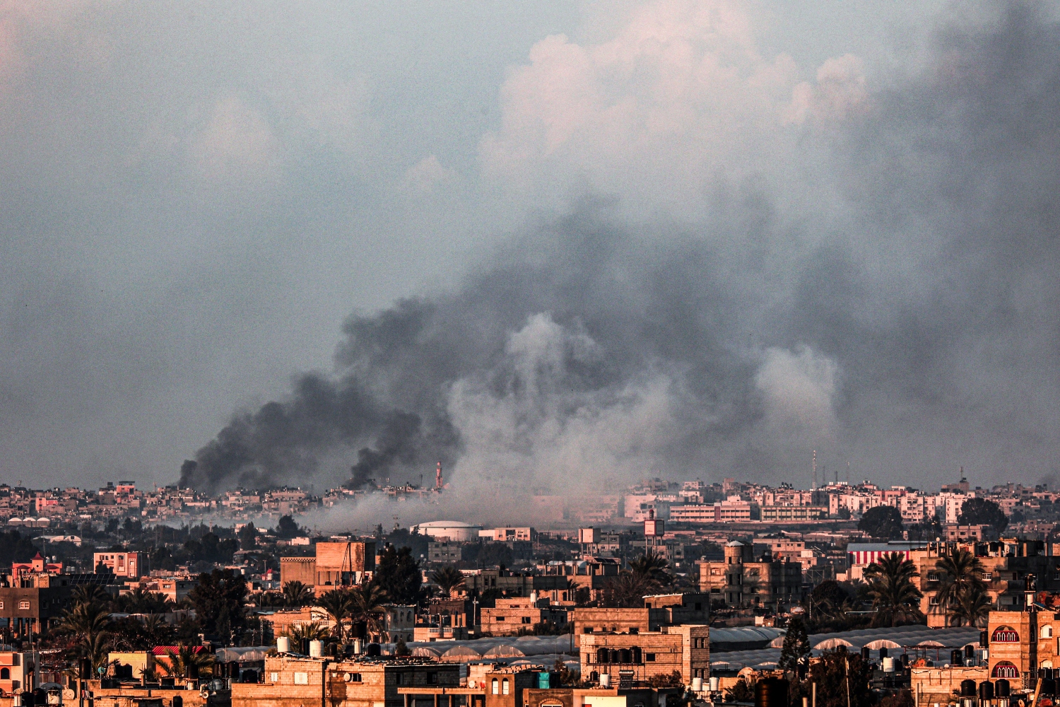 Smoke billows over Khan Younis in the southern Gaza Strip during Israeli bombardment. Feb. 18, 2024 (File/AFP)