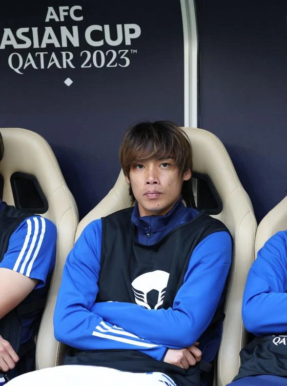 Japan’s midfielder Junya Ito is seen on the bench before a football match of the Qatar 2023 AFC Asian Cup against Bahrain at Al-Thumama Stadium in Doha on Jan. 31, 2024. (AFP)