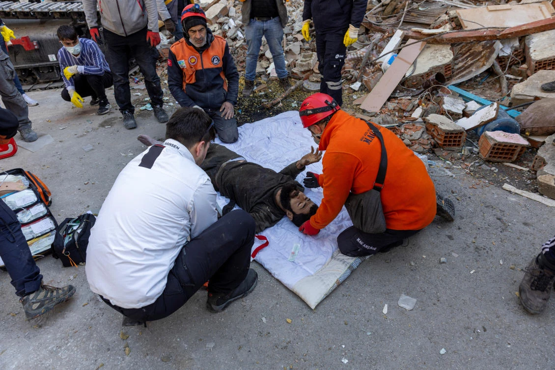 Abdulalim Muaini receives medical attention in the aftermath of a deadly earthquake in Hatay on Feb. 8, 2023. (Reuters)