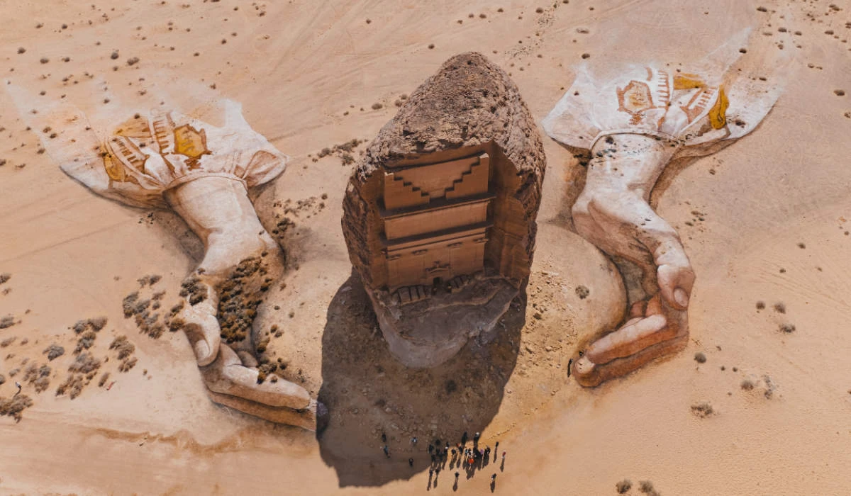 Royal Commission for Alula has partnered with American land artist David Popa to create an artwork featuring two giant hands emerging from the sands and cradling the iconic tomb of Lihyan son of Kuza. (Supplied)