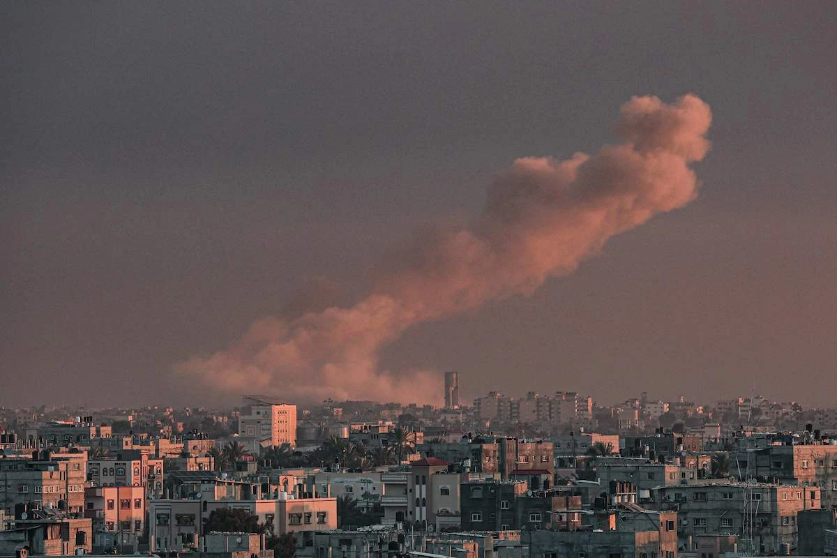 Smoke rises over buildings in Khan Yunis following Israeli bombardment on February 5, 2024. (AFP)