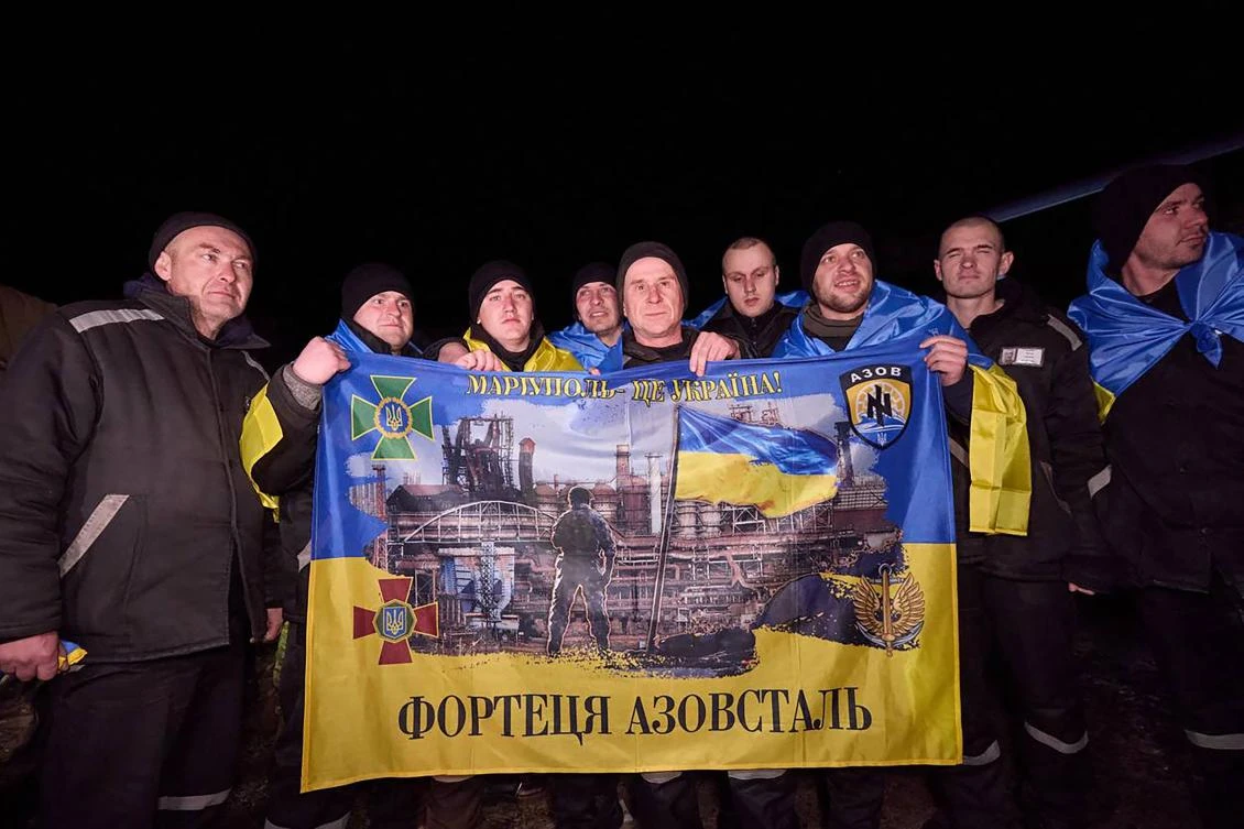 This handout photograph released by Ukrainian presidential press service on Feb. 8, 2024, shows Ukrainian prisoners of war posing for a photo following a swap at an undisclosed location in Ukraine. (AFP)