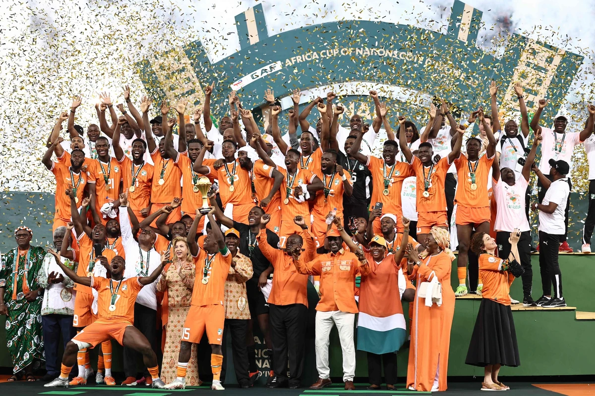Ivory Coast's forward Max-Alain Gradel (C) lifts the Africa Cup of Nations trophy on the podium after Ivory Coast won the Africa Cup of Nations 2024 final between Ivory Coast and Nigeria at Alassane Ouattara Olympic Stadium in Ebimpe, Abidjan on Feb. 11, 2024. (AFP)
