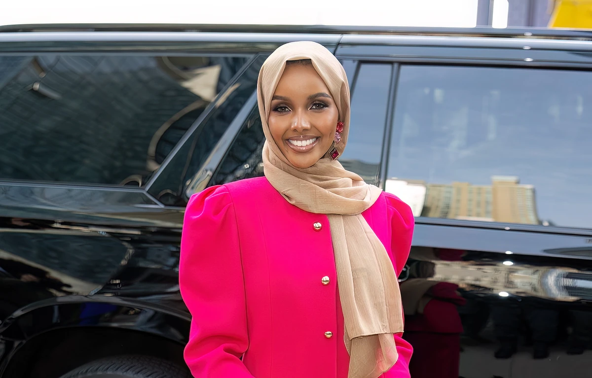 Halima Aden showed off a hot pink ensemble at the Carolina Herrera show. (Getty Images)