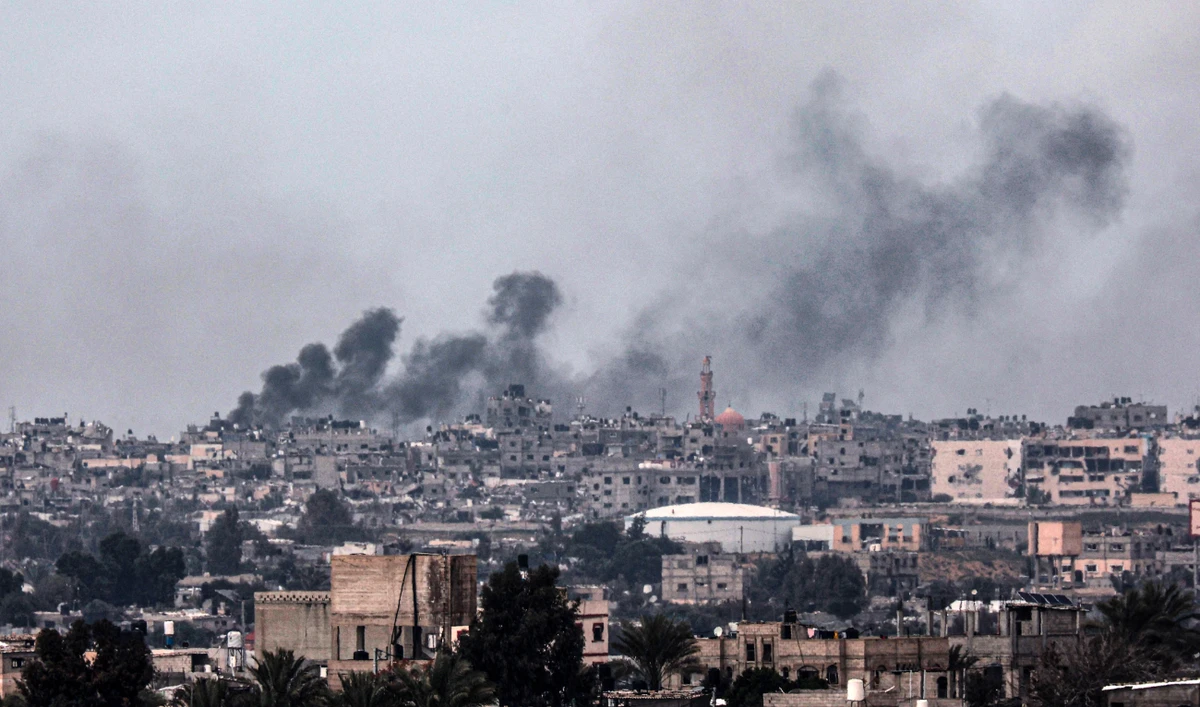 A picture taken from Rafah shows smoke billowing over Khan Yunis in the southern Gaza Strip during Israeli bombardment on February 18, 2024. (AFP)