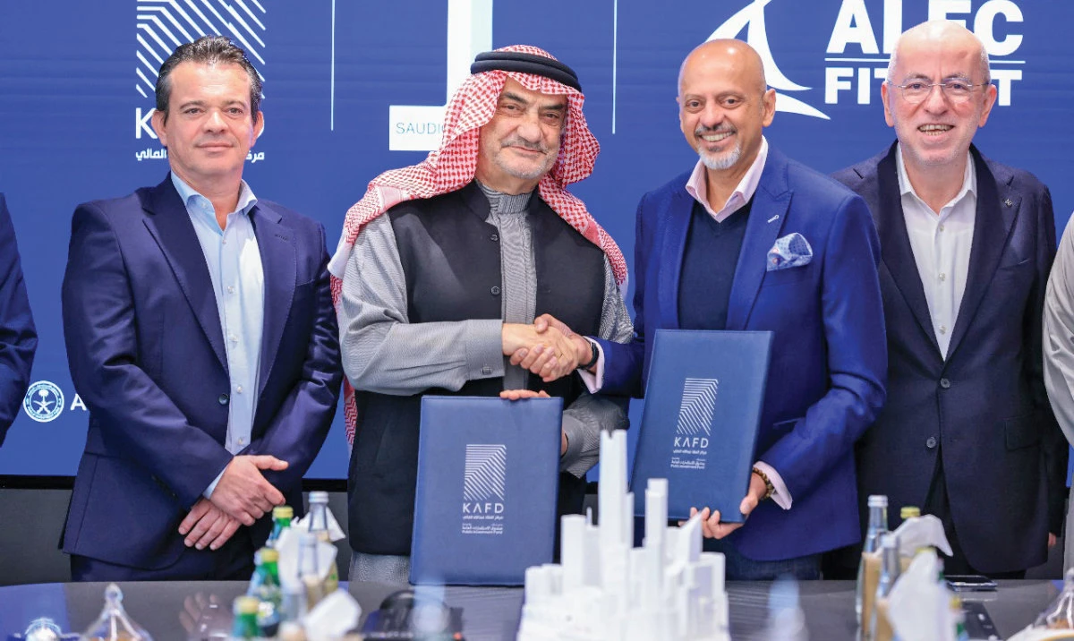 Saudico CEO Bashir Al-Azem and KAFD DMC CEO Gautam Sashittal sign the agreement, in the presence of Laurent Farge and Kadir Karademir.