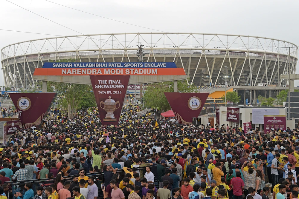 Spectators crowd to enter the Narendra Modi Stadium to watch the Indian Premier League Twenty20 final cricket match between Gujarat Titans and Chennai Super Kings in Ahmedabad on May 29, 2023. (AFP)