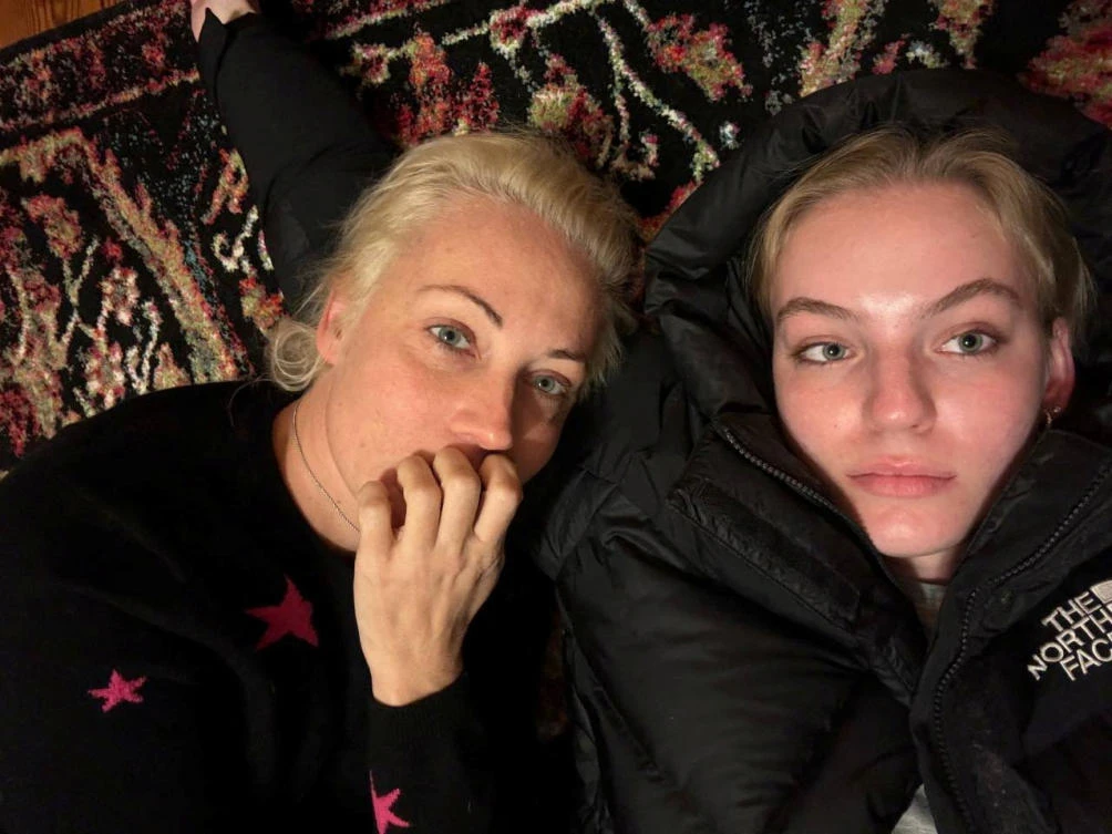 Yulia Navalnaya, the widow of Alexei Navalny, lies down with her daughter Dasha Navalnaya, in an unknown location, in this picture obtained from social media, released on Feb. 22, 2024. (Reuters)