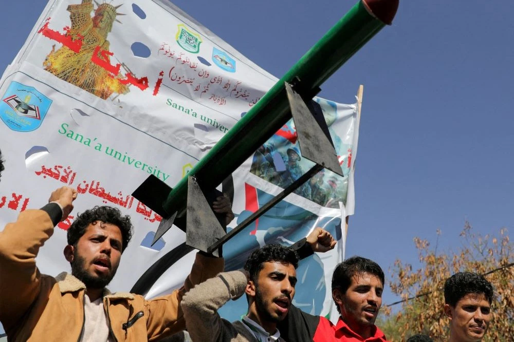 A mock missile is carried by Houthi supporters in Sanaa, Yemen, Jan. 31, 2024. (Reuters)