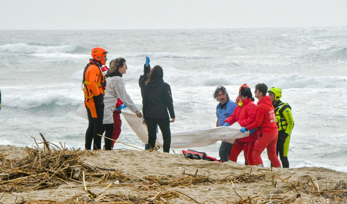 Rescuers are seen recovering a body after a migrant boat broke apart in rough seas, at a beach in Steccato di Cutro, in the Italian southern tip, killing at least 94 people in this Feb. 26, 2023 file photo. (AP)